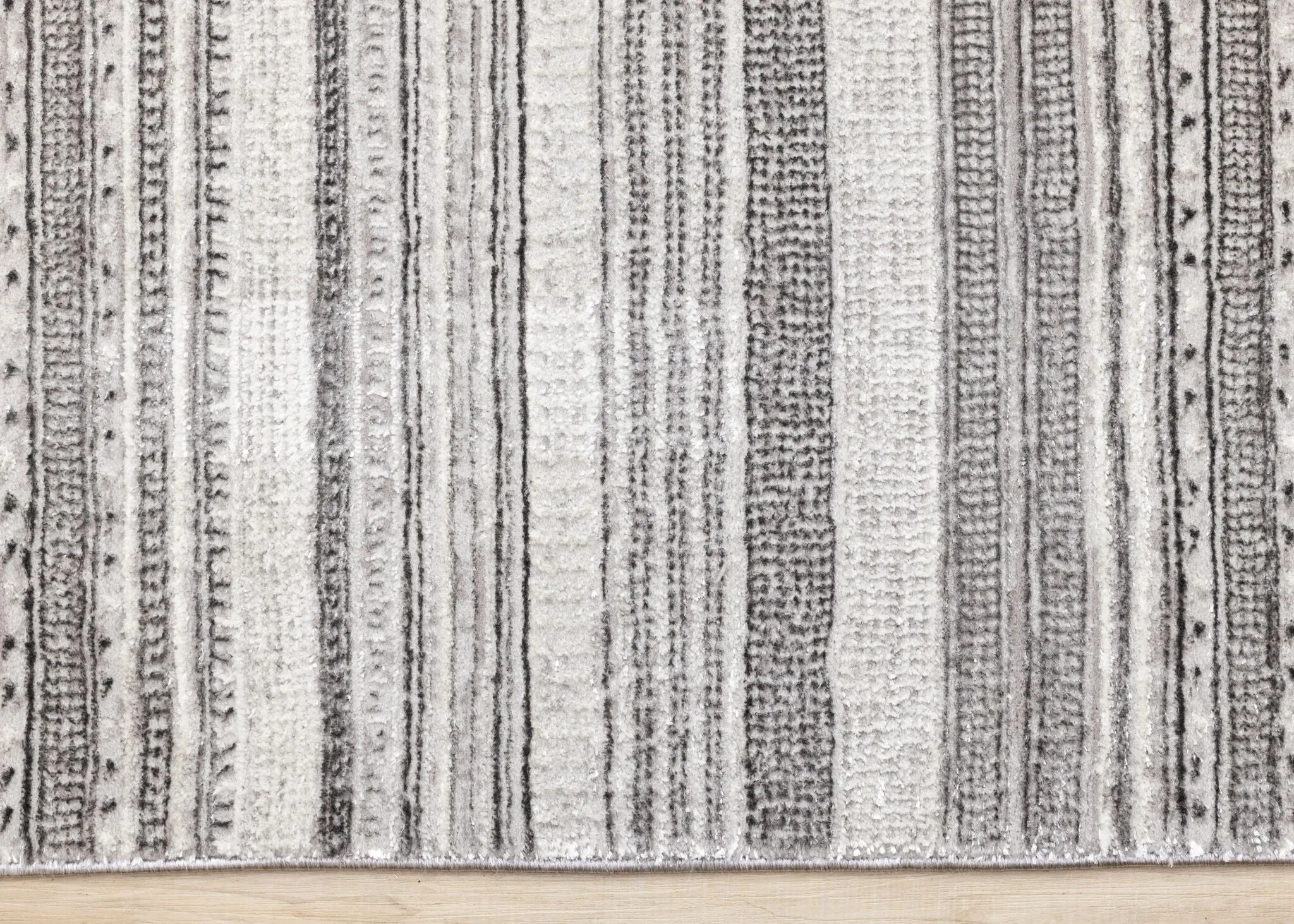 Zola 6'7" x 9'6" Patterned Rows Area Rug - Grey, White, Black